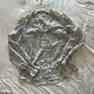 White collarless blouse with black flower detailing